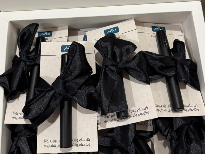 Bulk box of mini perfume favors (black cases) with black ribbon in Kuwait
