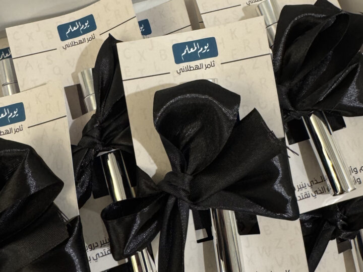 Teacher’s Day mini perfume favors with black ribbon and customizable card in Kuwait